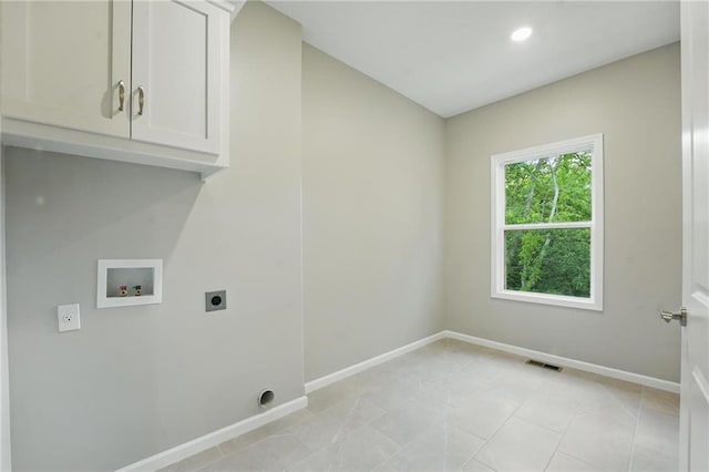 809 Highland Dr, Edwardsville, KS 66111 - laundry area with cabinet space, hookup for an electric dryer, hookup for a washing machine, baseboards, and recessed lighting