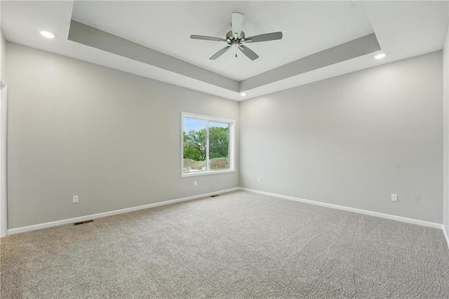809 Highland Dr, Edwardsville, KS 66111 - carpeted spare room featuring baseboards, recessed lighting, ceiling fan, and a raised ceiling