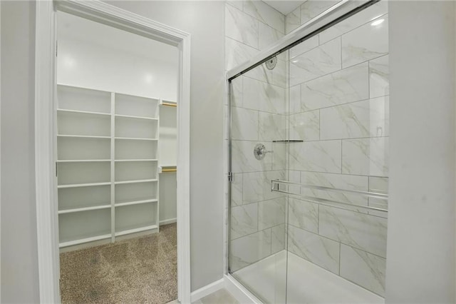 809 Highland Dr, Edwardsville, KS 66111 - full bath with a shower stall, a spacious closet, and baseboards