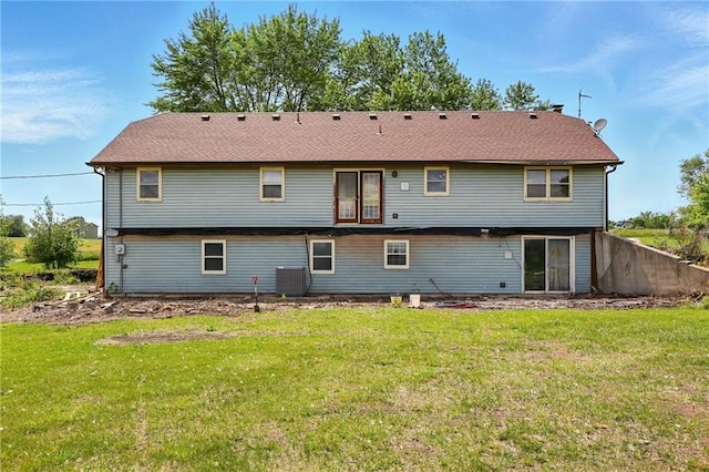 4613 SE Atchison Rd, Lathrop, MO 64465 - rear view of house with central AC and a lawn
