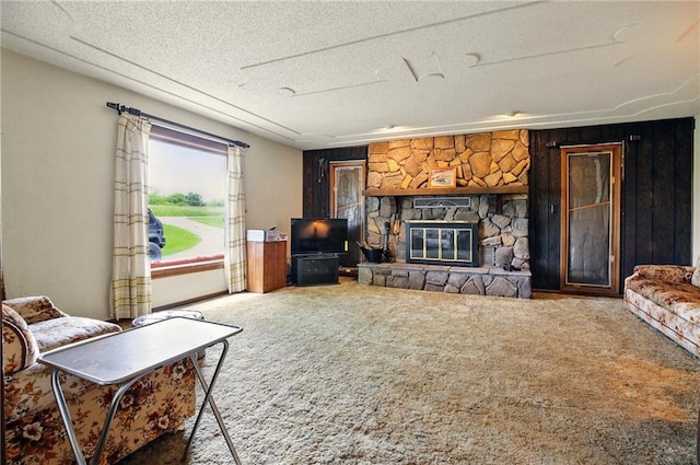 4613 SE Atchison Rd, Lathrop, MO 64465 - carpeted living area with a stone fireplace and a textured ceiling