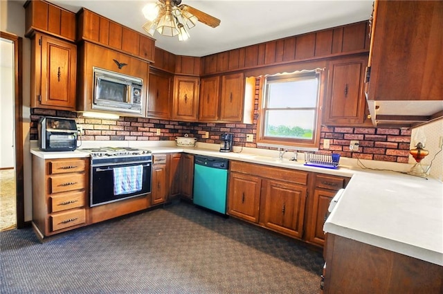 4613 SE Atchison Rd, Lathrop, MO 64465 - kitchen featuring dishwashing machine, stainless steel microwave, gas range, and light countertops