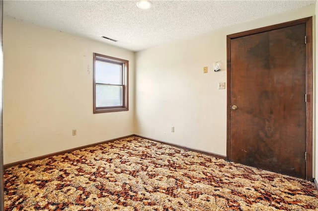 4613 SE Atchison Rd, Lathrop, MO 64465 - empty room featuring carpet flooring, a textured ceiling, and baseboards