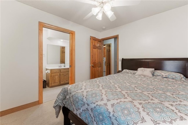 12484 S Hallet St, Olathe, KS 66062 - bedroom with light colored carpet, ceiling fan, baseboards, and connected bathroom