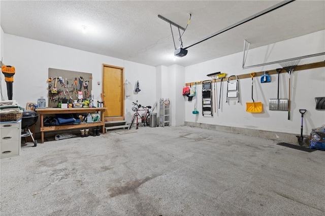 12484 S Hallet St, Olathe, KS 66062 - garage with a workshop area and a garage door opener
