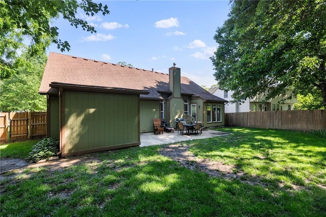12484 S Hallet St, Olathe, KS 66062 - rear view of house featuring a chimney and a patio