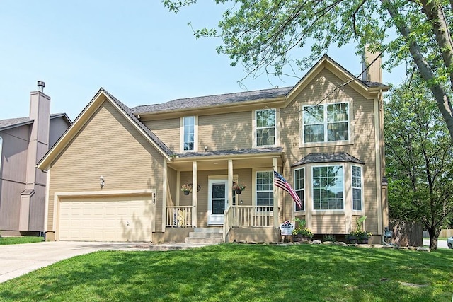 4737 Lone Elm St, Shawnee, KS 66226 - view of front of property with concrete driveway, a front lawn, and a porch