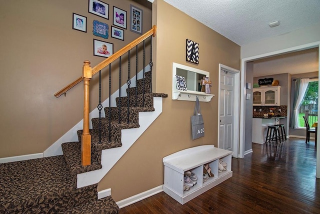 4737 Lone Elm St, Shawnee, KS 66226 - staircase with wood finished floors, baseboards, and a textured ceiling