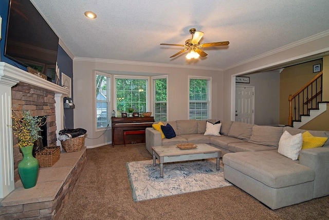 4737 Lone Elm St, Shawnee, KS 66226 - carpeted living room with a ceiling fan, ornamental molding, stairs, a fireplace with raised hearth, and baseboards