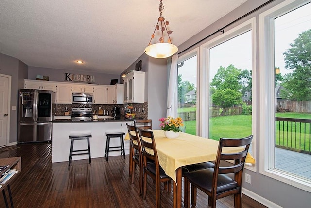 4737 Lone Elm St, Shawnee, KS 66226 - dining space with dark wood-style flooring and baseboards