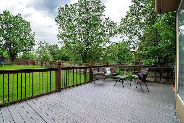 4737 Lone Elm St, Shawnee, KS 66226 - wooden deck with a trampoline and outdoor lounge area