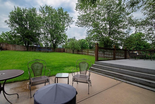 4737 Lone Elm St, Shawnee, KS 66226 - view of patio / terrace featuring a wooden deck and a trampoline