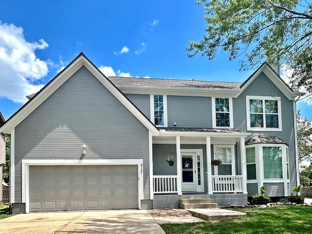 4737 Lone Elm St, Shawnee, KS 66226 - traditional-style home with a porch, concrete driveway, and a front yard
