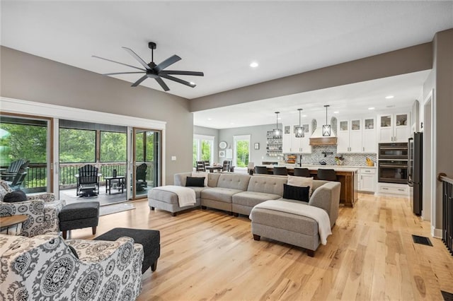 3112 Legacy Wood Dr, Lees Summit, MO 64086 - living area with light wood-style floors, a ceiling fan, and recessed lighting