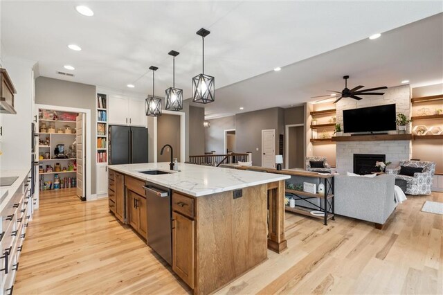 3112 Legacy Wood Dr, Lees Summit, MO 64086 - kitchen featuring dishwasher, a sink, fridge, ceiling fan, and light wood-style flooring