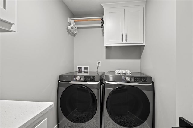 3112 Legacy Wood Dr, Lees Summit, MO 64086 - laundry area featuring washing machine and clothes dryer and cabinet space
