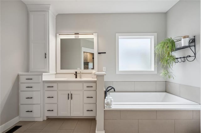 3112 Legacy Wood Dr, Lees Summit, MO 64086 - bathroom with vanity, a garden tub, tile patterned flooring, and baseboards