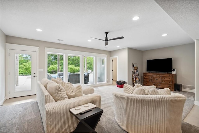 3112 Legacy Wood Dr, Lees Summit, MO 64086 - living room with a ceiling fan, recessed lighting, baseboards, light carpet, and a textured ceiling