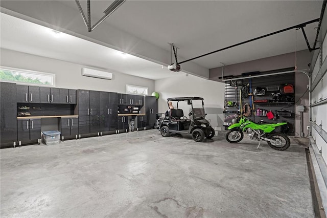 3112 Legacy Wood Dr, Lees Summit, MO 64086 - garage with a garage door opener and an AC wall unit