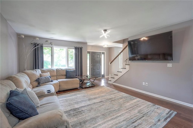 21614 W 72nd St, Shawnee, KS 66218 - living room with stairs, dark wood-type flooring, and baseboards