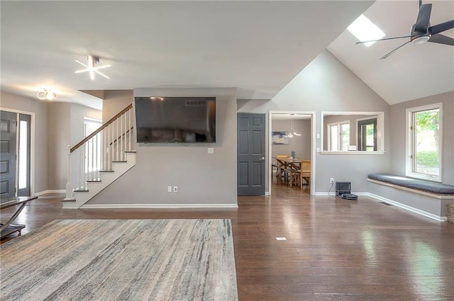 21614 W 72nd St, Shawnee, KS 66218 - unfurnished living room featuring wood finished floors, stairway, baseboards, a ceiling fan, and high vaulted ceiling