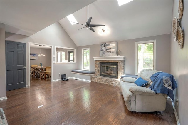 21614 W 72nd St, Shawnee, KS 66218 - living area with ceiling fan, baseboards, a fireplace, high vaulted ceiling, and wood finished floors