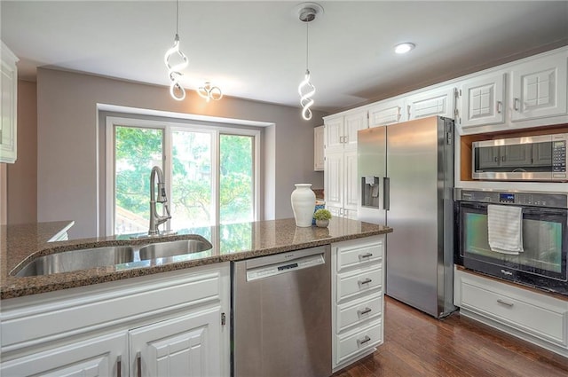 21614 W 72nd St, Shawnee, KS 66218 - kitchen featuring stainless steel appliances, a sink, and white cabinets