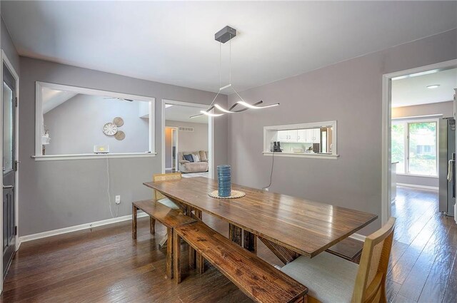 21614 W 72nd St, Shawnee, KS 66218 - dining area with hardwood / wood-style flooring, baseboards, and a chandelier