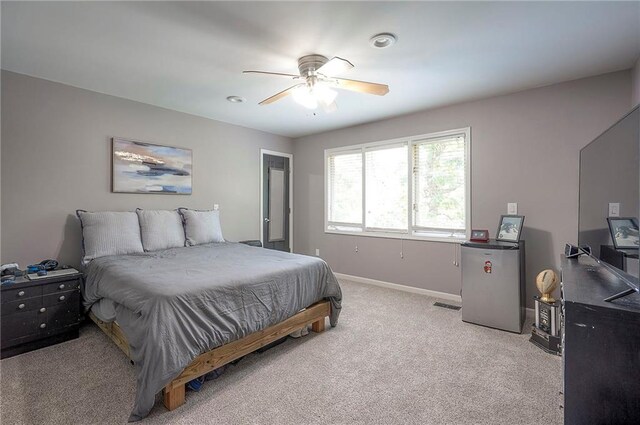 21614 W 72nd St, Shawnee, KS 66218 - bedroom featuring light colored carpet, baseboards, a ceiling fan, and freestanding refrigerator