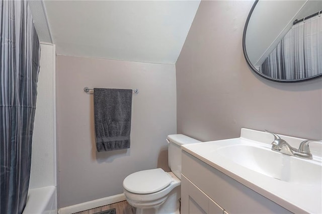 21614 W 72nd St, Shawnee, KS 66218 - bathroom featuring vanity, toilet, and lofted ceiling