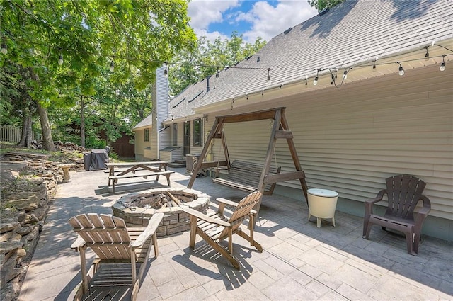 21614 W 72nd St, Shawnee, KS 66218 - view of patio with an outdoor fire pit and entry steps
