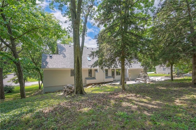 21614 W 72nd St, Shawnee, KS 66218 - rear view of house featuring a patio and a shingled roof