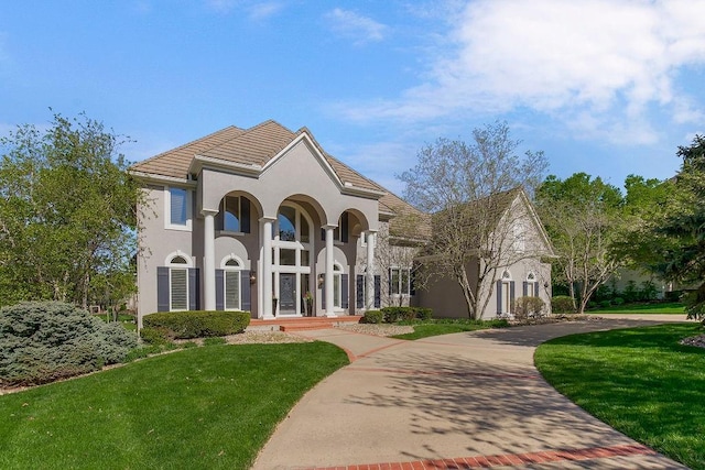 9705 Sunset Cir, Lenexa, KS 66220 - view of front of home featuring stucco siding and a front yard