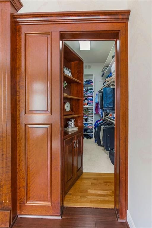 9705 Sunset Cir, Lenexa, KS 66220 - spacious closet featuring wood finished floors