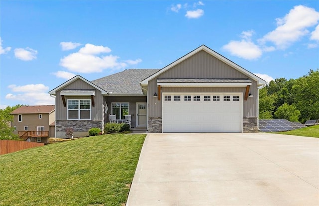 481 Olive Ct, Warrensburg, MO 64093 - craftsman-style home featuring stone siding, board and batten siding, driveway, and a front yard