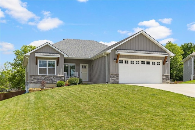 481 Olive Ct, Warrensburg, MO 64093 - craftsman-style home with stone siding, concrete driveway, an attached garage, and board and batten siding
