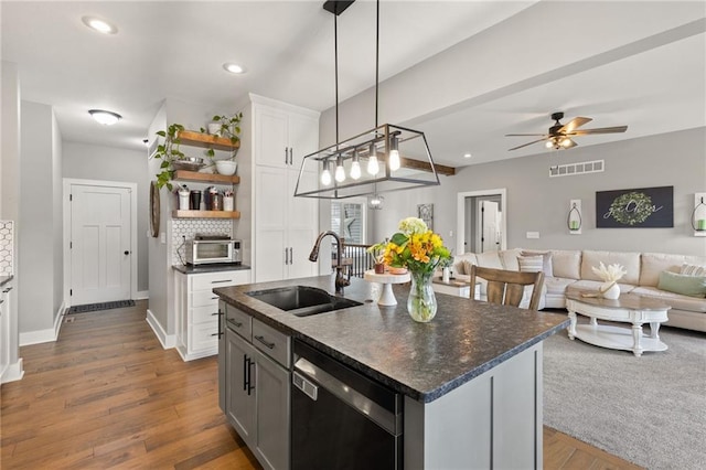 481 Olive Ct, Warrensburg, MO 64093 - kitchen featuring stainless steel dishwasher, a sink, open shelves, open floor plan, and a ceiling fan