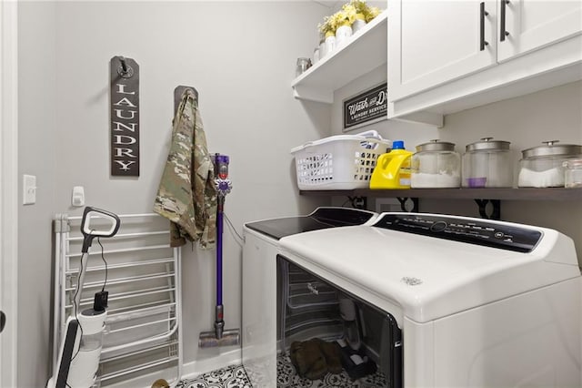 481 Olive Ct, Warrensburg, MO 64093 - washroom with separate washer and dryer, cabinet space, and baseboards