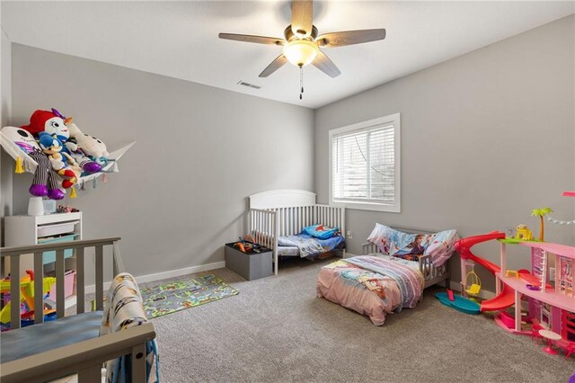 481 Olive Ct, Warrensburg, MO 64093 - bedroom featuring carpet flooring, ceiling fan, and baseboards