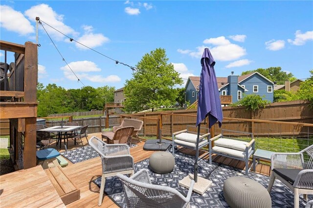481 Olive Ct, Warrensburg, MO 64093 - deck with outdoor dining area