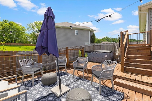 481 Olive Ct, Warrensburg, MO 64093 - deck with a hot tub, a fenced backyard, and a patio area