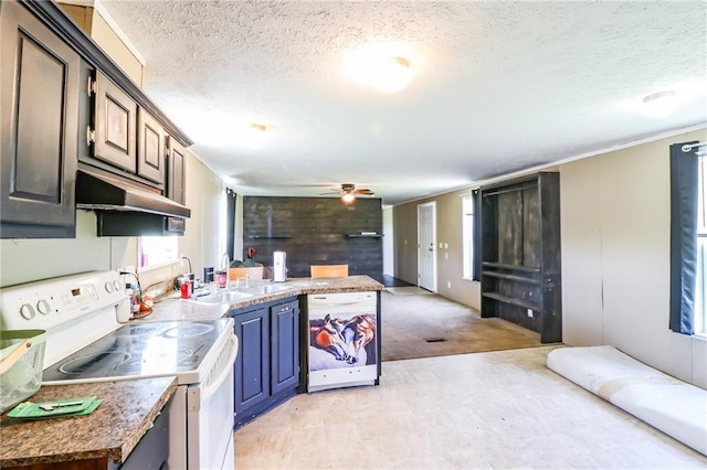 614 SW T Hwy, Holden, MO 64040 - kitchen with white appliances, a ceiling fan, a textured ceiling, under cabinet range hood, and a peninsula