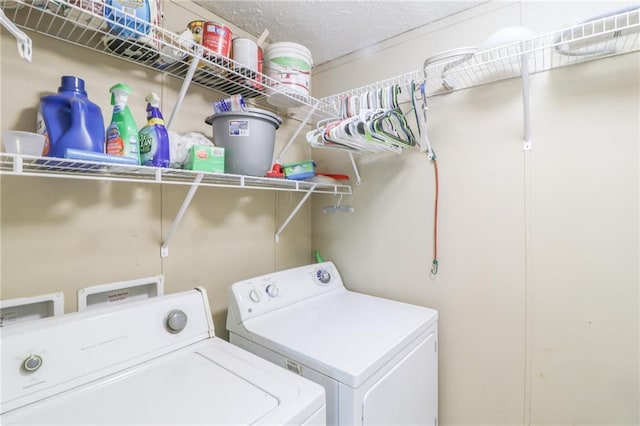 614 SW T Hwy, Holden, MO 64040 - washroom featuring washing machine and dryer and a textured ceiling