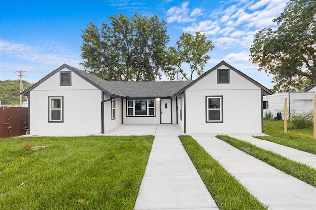 1709 Marty Ave, Kansas City, KS 66103 - view of front of property with a patio and a shingled roof