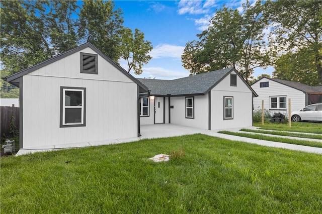 1709 Marty Ave, Kansas City, KS 66103 - view of front of home featuring a front lawn, a patio, and roof with shingles