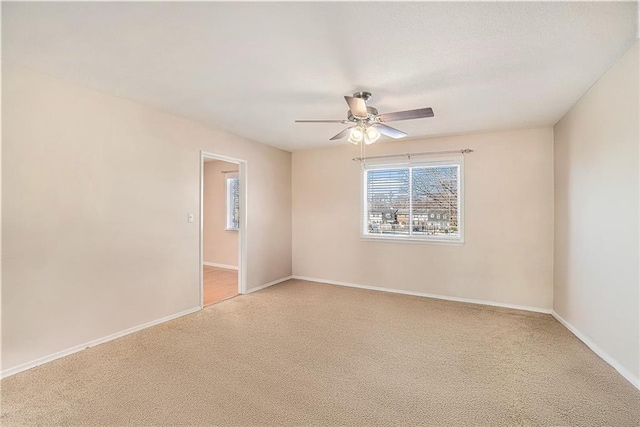 8564 W 85th St, Overland Park, KS 66212 - spare room with light colored carpet and a ceiling fan