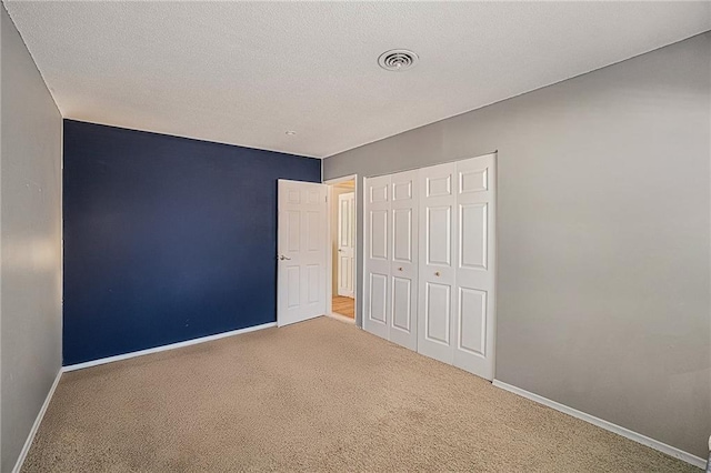 8564 W 85th St, Overland Park, KS 66212 - unfurnished bedroom featuring carpet flooring, a closet, and a textured ceiling