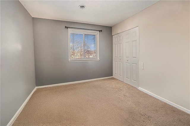 8564 W 85th St, Overland Park, KS 66212 - unfurnished bedroom featuring carpet and a closet
