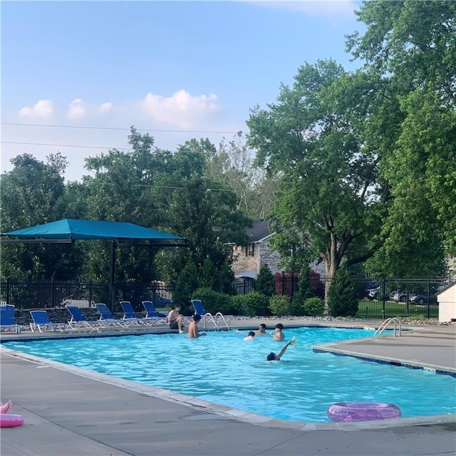 8564 W 85th St, Overland Park, KS 66212 - community pool with a patio and view of scattered trees