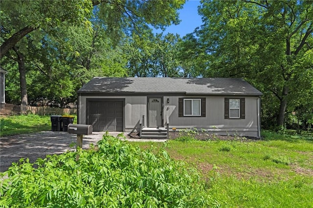 6 W 98th Ter, Kansas City, MO 64114 - view of front facade with an attached garage and gravel driveway